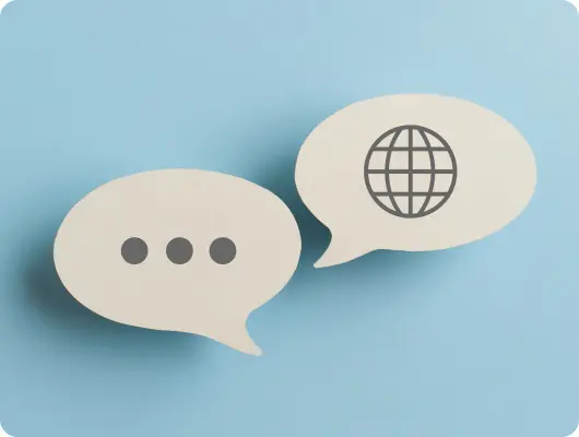 会話を表す2つの吹き出しと多言語対応を示す地球儀アイコン